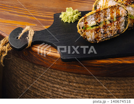 Deep fried sushi rolls with wasabi and sesame topping Deep fried sushi rolls with wasabi and sesame topping 140674518