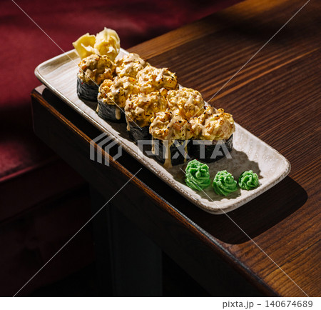 Baked sushi rolls with spicy mayo, wasabi, and ginger 140674689