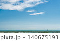 calm sea with a yacht sailing on the horizon, a summer vacation concept and an invitation to a tour or yacht trip, copy space for text 140675193