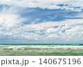 Stormy seas and strong winds, time for windsurfing and active holidays on the coast, copy space for text and the concept of the summer holiday season 140675196