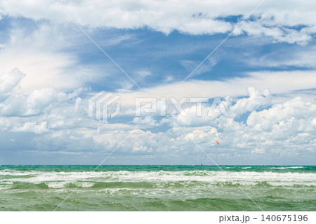 Stormy seas and strong winds, time for windsurfing and active holidays on the coast, copy space for text and the concept of the summer holiday season 140675196