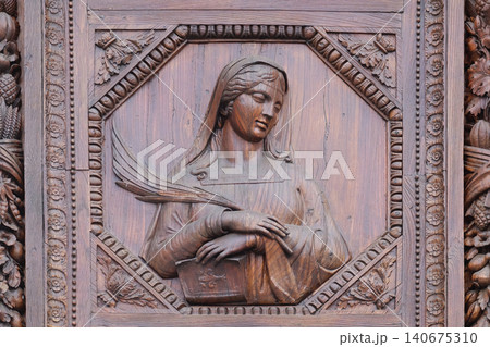 Saint, wooden door of the Basilica of Santa Croce (Basilica of the Holy Cross) in Florence, Italy Saint, wooden door of the Basilica of Santa Croce (Basilica of the Holy Cross) in Florence, Italy 140675310