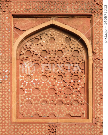 Stone pattern on a temple wall in Red Fort, Agra, UNESCO World heritage site, India Stone pattern on a temple wall in Red Fort, Agra, UNESCO World heritage site, India 140675312