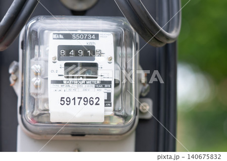 Electric measuring power meter for energy cost at home and office. 140675832