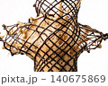 Symmetrical cross intersection splash of coffee cream wrapped in chocolate netting. 140675869
