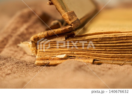 Old pages bring back warm memories. Weathered pages of antique book evoke heartfelt nostalgia and soothing atmosphere Old pages bring back warm memories. Weathered pages of antique book evoke heartfelt nostalgia and soothing atmosphere 140676632