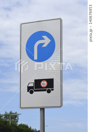 Mandatory directional turn traffic sign for trucks over height limit Mandatory directional turn traffic sign for trucks over height limit 140676953