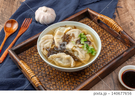 Chinese Dumplings in Hot and Sour Soup with Chili Oil and Cilantro Chinese Dumplings in Hot and Sour Soup with Chili Oil and Cilantro 140677656