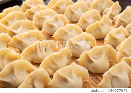 Close-Up of Freshly Made Chinese Dumplings - Ready to Cook Close-Up of Freshly Made Chinese Dumplings - Ready to Cook 140677671