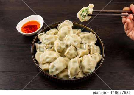 Steamed Mackerel Dumplings on Plate with Dipping Sauce 140677681