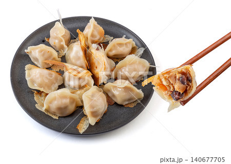 Golden pan-fried Chinese dumplings Jiaozi with premium sea cucumber and shrimp filling 140677705