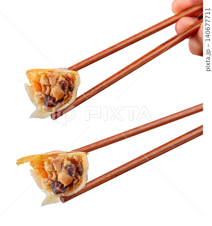 Golden pan-fried Chinese dumplings Jiaozi with premium sea cucumber and shrimp filling Golden pan-fried Chinese dumplings Jiaozi with premium sea cucumber and shrimp filling 140677711