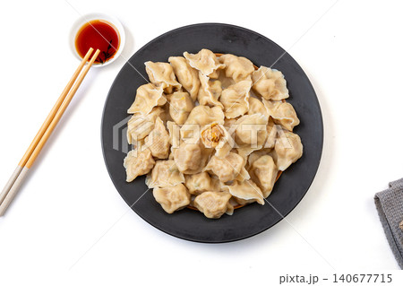 Traditional Chinese dumplings Jiaozi with pork and sauerkraut filling served with dipping sauce Traditional Chinese dumplings Jiaozi with pork and sauerkraut filling served with dipping sauce 140677715