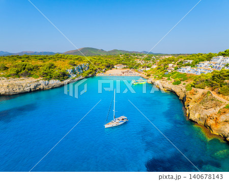 Aerial view of a sea bay and azure water in Mallorca, Spain. Aerial view of a sea bay and azure water in Mallorca, Spain. 140678143