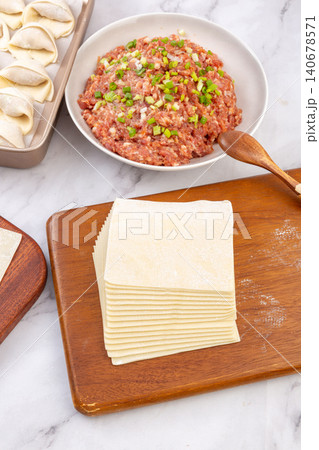Ingredients for Making Chinese Wontons with Dumpling Wrappers and Minced Meat Stuffing 140678571