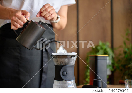 Person making drip coffee at home Person making drip coffee at home 140679306