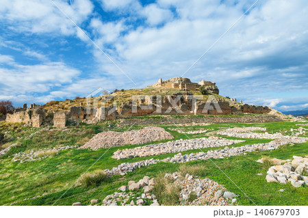 Acropolis, carved in rock tombs of ancient Greek city Tlos in Lycia located on Lycian way. Famous historical site In Antalya region. Popular place for family travel on summer vacation. Fethiye, Turkey 140679703