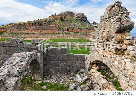 Market place, acropolis of ancient Greek city Tlos in Lycia located on Lycian way. Famous historical site In Antalya region. Popular place for family travel on summer vacation. Fethiye, Turkey Market place, acropolis of ancient Greek city Tlos in Lycia located on Lycian way. Famous historical site In Antalya region. Popular place for family travel on summer vacation. Fethiye, Turkey 140679705