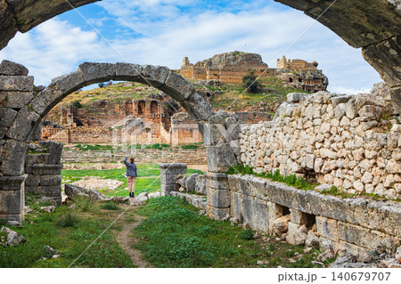 Young child looks at acropolis of ancient Greek city Tlos in Lycia located on Lycian way. Famous historical site In Antalya region. Popular place for family travel on summer vacation. Fethiye, Turkey Young child looks at acropolis of ancient Greek city Tlos in Lycia located on Lycian way. Famous historical site In Antalya region. Popular place for family travel on summer vacation. Fethiye, Turkey 140679707