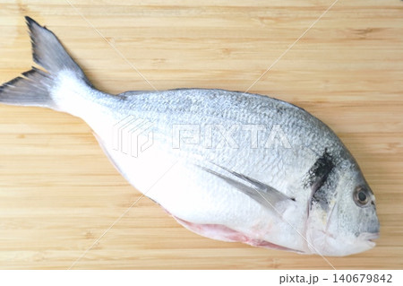 Raw sea fish. A close-up shot of raw fish, cooking delicious food at home. Raw sea fish. A close-up shot of raw fish, cooking delicious food at home. 140679842