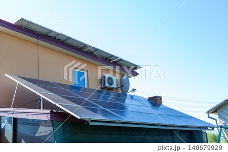 Home solar energy system on private house exterior Home solar energy system on private house exterior 140679929