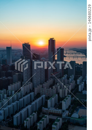 Golden sunset over the financial district of Yeouido with modern corporate skyscrapers in Seoul, South Korea Golden sunset over the financial district of Yeouido with modern corporate skyscrapers in Seoul, South Korea 140680229