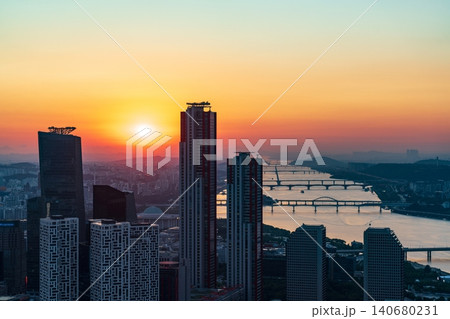 Golden sunset over the financial district of Yeouido with modern corporate skyscrapers in Seoul, South Korea 140680231