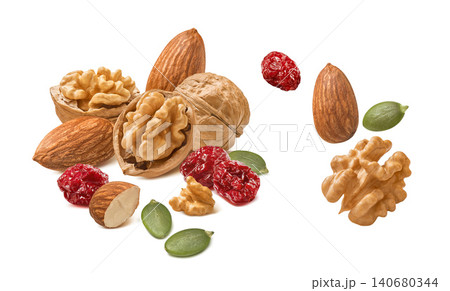 Almond and walnut nuts, dried cranberry, green pumpkin seeds isolated on white background 140680344