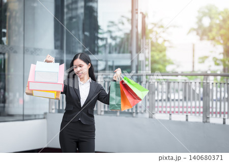 Happy woman with shopping bags enjoying in shopping. Happy woman with shopping bags enjoying in shopping. 140680371
