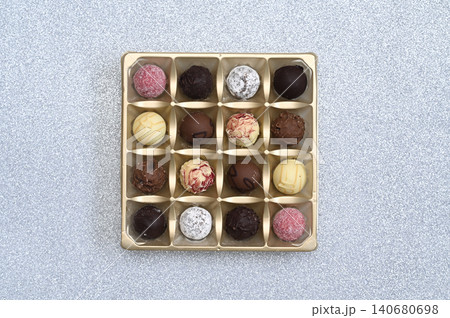 Chocolate candies arranged in square box. Chocolate candies arranged in square box. 140680698