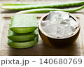 aloe vera and pieces of its pulp on a wooden pit 140680769