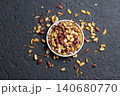 Pile of roasted peanuts on black background, space for text 140680770