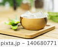 aloe vera and pieces of its pulp on a wooden pit 140680771