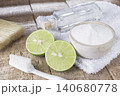 baking soda and lemon on wooden table 140680778
