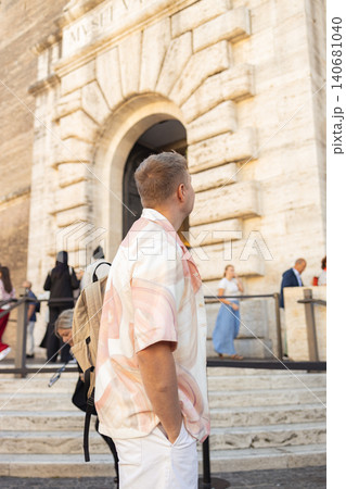 Male tourist posing near ancient Roman architecture in Rome, Italy Male tourist posing near ancient Roman architecture in Rome, Italy 140681040