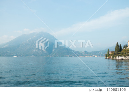 Sailboat on Lake Como against a mountain backdrop 140681106