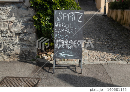 Chalkboard menu sign outside european cafe advertising summer cocktails Chalkboard menu sign outside european cafe advertising summer cocktails 140681153
