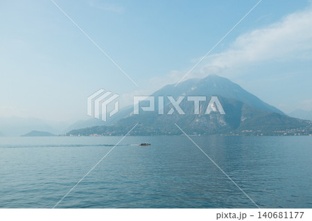 Scenic alpine lake view with mountains on a cloudy day Scenic alpine lake view with mountains on a cloudy day 140681177