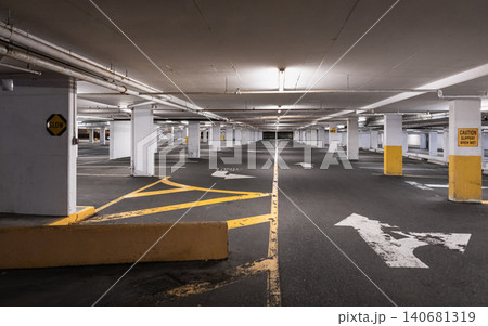 Basement public parking garage with empty parking spaces, concrete columns. Modern Minimalist Interior of Empty new underground car parking. Concrete grunge style. Nobody 140681319
