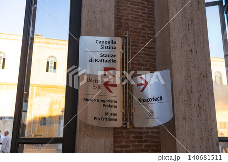 Directional signs for tourists in Vatican Museums showing way to Sistine Chapel and Raphael Rooms in Rome, Italy Directional signs for tourists in Vatican Museums showing way to Sistine Chapel and Raphael Rooms in Rome, Italy 140681511