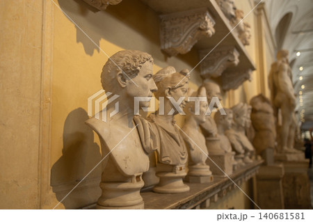 Row of classical marble bust statues in historic museum gallery interior 140681581