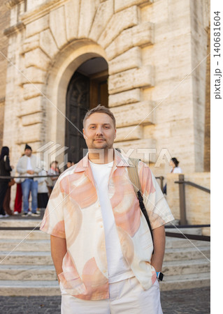 Male tourist posing near ancient Roman architecture in Rome, Italy Male tourist posing near ancient Roman architecture in Rome, Italy 140681604