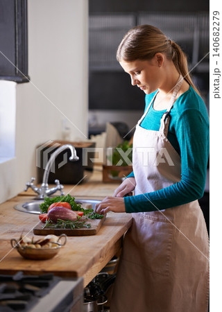 Nutrition, cooking and woman with vegetables in kitchen cutting ingredients with knife at home. Vitamins, groceries and female person with organic produce for dinner, supper or meal at apartment. Nutrition, cooking and woman with vegetables in kitchen cutting ingredients with knife at home. Vitamins, groceries and female person with organic produce for dinner, supper or meal at apartment. 140682279