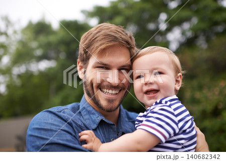 Portrait, smile or father with toddler in outdoor, love or together in nature for child growth or development. Happy family, dad or holding kid for bonding, face or responsibility for son on weekend 140682342