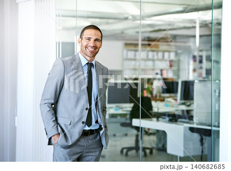 Confident, portrait and man in conference room at office for business as realtor in London with happiness. Professional, entrepreneur or expert real estate agent for development in corporate property 140682685