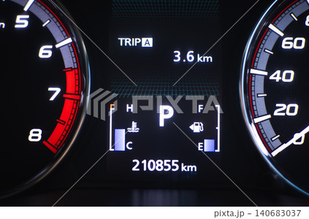 Digital dashboard speedometer tachometer odometer trip meter vehicle instrument panel car display fuel gauge engine temperature gauge mileage 3.6 km 210855 km parking gear illuminated panel black 140683037