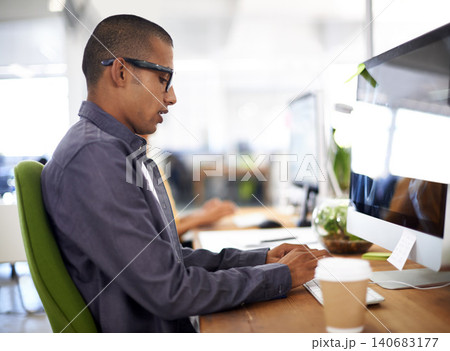 Computer, typing and businessman in office, employee and writing for work project. Eyewear, desk and technology with internet for design by graphic designer, keyboard and online in workspace Computer, typing and businessman in office, employee and writing for work project. Eyewear, desk and technology with internet for design by graphic designer, keyboard and online in workspace 140683177