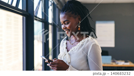 Phone, networking and professional black woman in the office browsing on social media or the internet. Smile, technology and African female person scroll on mobile app with cellphone in workplace. Phone, networking and professional black woman in the office browsing on social media or the internet. Smile, technology and African female person scroll on mobile app with cellphone in workplace. 140683232