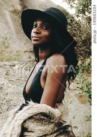 African woman, fashion and closeup with nature, portrait and beach for adventure. Tourist, clothes and holiday for vacation, proud and sunshine for relax and travel in summer for trendy and style African woman, fashion and closeup with nature, portrait and beach for adventure. Tourist, clothes and holiday for vacation, proud and sunshine for relax and travel in summer for trendy and style 140683284