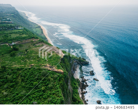 Ocean cliffs with crashing waves on a tropical scenic coastline 140683495